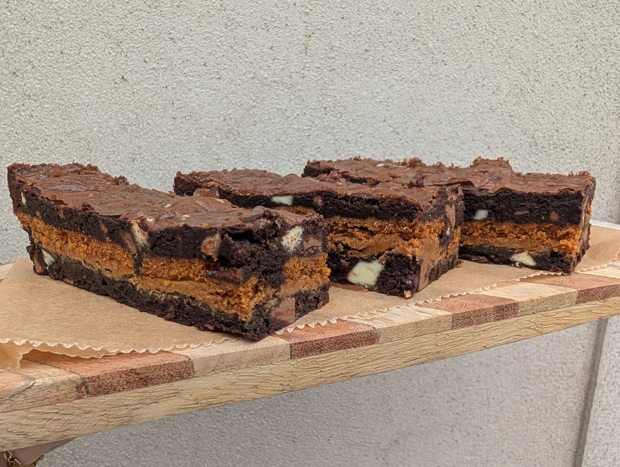 Layered chocolate brownies with biscuit centre